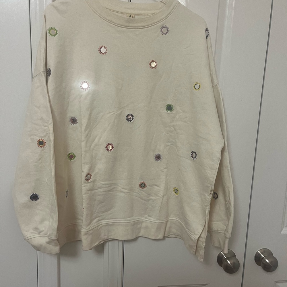 Cream Sweatshirt with Colorful Sunburst Design